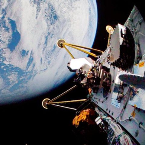 A spacecraft with Earth behind it